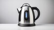 © Lori - the sleek stainless steel kettle stands alone on a plain white backdrop