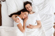 © Prostock-studio - Married Couple Sleeping Together Embracing Lying In Comfortable Bed At Home At Night. Top View Shot Of Spouses Resting Peacefull Enjoying Nap In Comfortable Bedroom