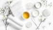 © Sarut - A peaceful and soothing spa inspired composition featuring delicate white flowers soft towels and natural cosmetic products for a relaxing and rejuvenating wellness experience