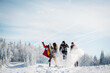 © Halfpoint - Group of friends enjoying winter time in snowy nature.