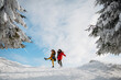 © Halfpoint - Two female friends walking in winter forest during holidays