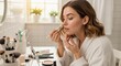 © NN AI - Young woman applying foundation with makeup brush in bright bathroom. Morning beauty routine with cosmetics. Skincare and self-care concept