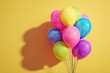 © Oleksandr - Colorful balloon arrangement with blank panel on vivid color background for headlines
