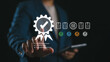 © Nirusmee - Businessman selecting a quality assurance certification icon on a virtual screen, symbolizing ISO standards, compliance, quality control, and business process improvement in corporate governance.
