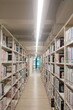 © YiChuan - Taipei, Taiwan - Nov 30th 2025 - Modern library bookshelf aisle with bright interior lighting.