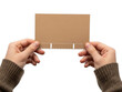 © Poly - Hands holding brown card isolated on transparent background