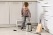 © New Africa - Child safety at home. Little boy playing with kitchen supplies indoors