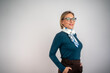 © Nenad - Confident businesswoman smiling at the camera