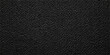 © ITS OK - A dark macro shot of a black leather texture background features a natural rough pattern on a textured skin surface, creating a close-up material design for a textile backdrop or wallpaper