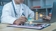 © Sky view - Doctor in white coat using digital pen on tablet with AI brain and medical record interface overlay. Concept of artificial intelligence, electronic health records, smart healthcare and medical data ma
