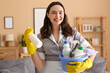 © Pixel-Shot - Young chambermaid with cleaning supplies in room