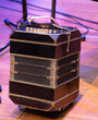 © Baudalab - Bandoneon musical instrument. A bandoneon resting on an old tango dance floor.