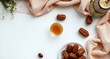 © AN Pixora - Ramadan iftar setting with dates and tea on clean background, flat lay minimalist background