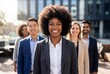 © Meow Creations - Smiling diverse business team standing together outdoors in front of a modern office building
