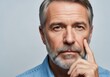 © Png stock - Mature man with gray beard and mustache resting his chin on his hand, looking thoughtful and serious