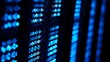 © shan - Close-up of glowing blue server rack lights creating an abstract technological pattern on a dark background.