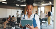 © Flash25/peopleimages.com - Reading, info and woman with tablet, seminar and event planner with schedule on website or browsing. Checking, checklist and person with tech for coordination, scroll and online in conference hall