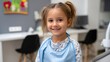© Kliapko_Photo - Child patient wearing a lead apron during a dental x-ray in a colorful, child-friendly clinic