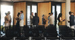 © Flash25/peopleimages.com - Business, people and talking for venture, conference hall or collaboration for global trade at event. Group, discussion and plan for foreign investment, meeting and partnership in workshop or seminar
