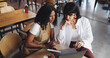 © AzeemudDeen25/peopleimages.com - Cafe owner, barista and meeting with tech for online inventory checklist, staff schedule or review supplier info. Women, boss and waitress on tablet for menu planning, laptop and coffee shop budget
