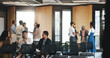 © Flash25/peopleimages.com - Business people, meeting or group in lobby for seminar, upskill workshop or corporate training conference. Colleagues, employees and conversation in foyer for professional development at convention