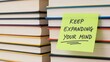 © adelina - Mind Expansion Books Stacked with Reminder Note.