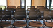 © Flash25/peopleimages.com - Chairs, seminar and empty room for business event, forum and convention or meeting venue. Furniture, hall and interior of conference center with rows for summit, presentation or seats for workshop