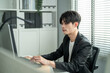© Kawee - Asian attractive businessman employee working in the office workplace.