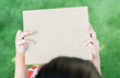 © Kunlathida - Selective focus of a rectangular cardboard box in children's hands with copy space.