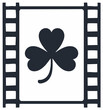 © Дмитро Менчинський - Film strip frame with cloverleaf symbol inside for St Patricks Day or luck themed video production