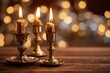 © Maryna - Cozy candlelit scene featuring gold candles and blurred background lights with negative space for copy