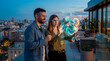 © Rendara Studio - Rooftop sunset collaboration as colleagues explore a holographic interface above the city