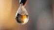 © Pugalas - Close-up of a water droplet hanging from a faucet.