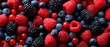 © TANATPON - Mixed fresh berries closeup with vibrant colors and rich natural textures