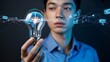© Marzan - Futuristic concept of human intelligence and artificial intelligence with a man holding a light bulb containing a glowing brain.