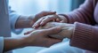 © The Little Hut - Compassionate Caregiver Holding Senior Woman's Hands Offering Comfort and Support During a Healthcare Visit
