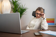 © Nenad - Business woman having headache at office