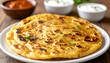 © hardvicore - Aloo paratha with dipping sauces on wooden table, tasty Indian meal, delicious snack.