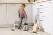 © New Africa - Child safety at home. Little boy playing with kitchen supplies indoors