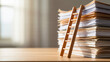 © olgakris - Symbolic image of a wooden ladder leaning on a tall stack of documents representing career growth, bureaucracy, paperwork overload, academic pressure, office work, and professional development