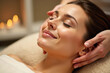 © Krystyna - Woman receiving luxury spa massage. Relaxing massage therapy concept. Wellness spa treatment portrait.