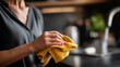 © Kateryna - Faceless closeup woman hands small towel cleaning kitchen household maintenance activity domestic cleaning task home care moment organization defocused kitchen background wit