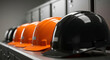 © starush - Safety helmets lined on locker bench in industrial changing room for crews