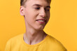 © SHOTPRIME STUDIO - Smiling man in a yellow shirt against a bright yellow backdrop, showcasing cheerful mood, casual style, and positive energy in a vibrant studio setting with warm lighting