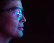 © Westend61 - Engineer with glasses reflecting digital interface in futuristic setting