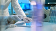 © wkproduction - A scientist in a lab coat and gloves examines a document, surrounded by advanced lab equipment, highlighting precision and innovation in a high-tech research setting.