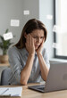 © Julia Melnyk - Stressed Businesswoman Overwhelmed by Email Overload at Office Laptop