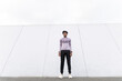© VISTA by Westend61 - Athlete standing outdoors in urban setting with confident expression