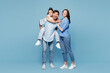 © ViDi Studio - Full body young fun happy parents mom dad with child kid daughter girl wear casual clothes giving piggyback ride to joyful, sit on back isolated on plain blue background. Family day childhood concept.