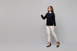 © ViDi Studio - Full body young employee business woman corporate lawyer wear black sweater glasses shirt work in office point index finger aside on area walk isolated on plain grey color background studio portrait.